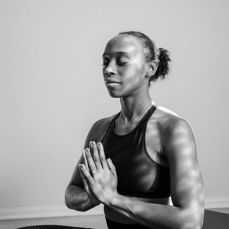 woman sitting doing yoga calm