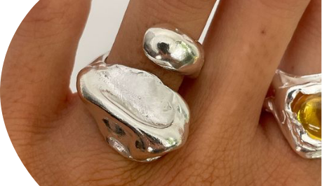 hand with organic silver rings